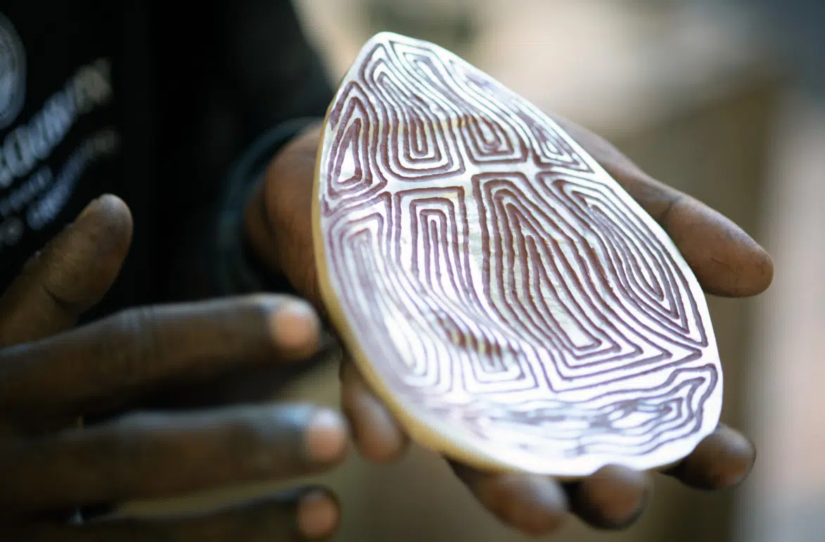 A Riji is held during an explanation of it's cultural significance.
