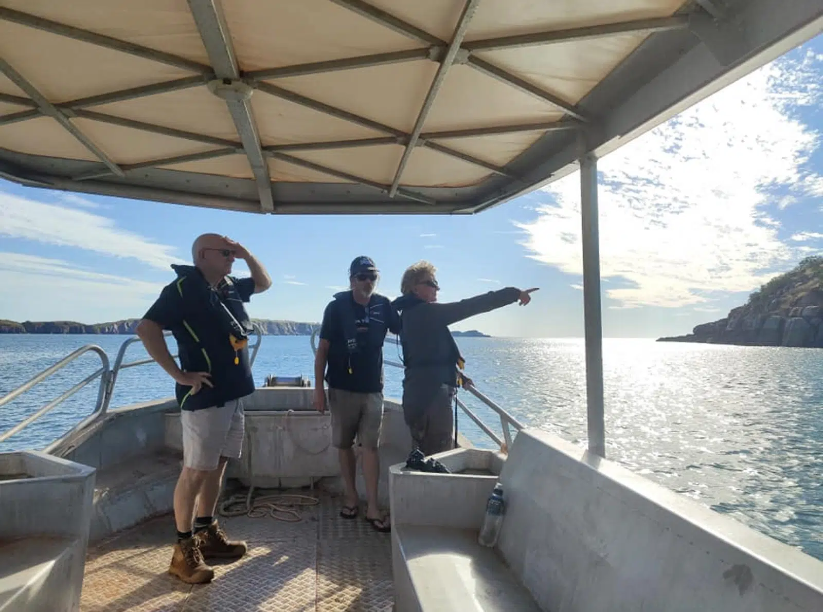 Guests wearing life jackets taking in the stunning landscape of the Kimberley, while surrounded by the islands that make up the Buccaneer Archipelago.