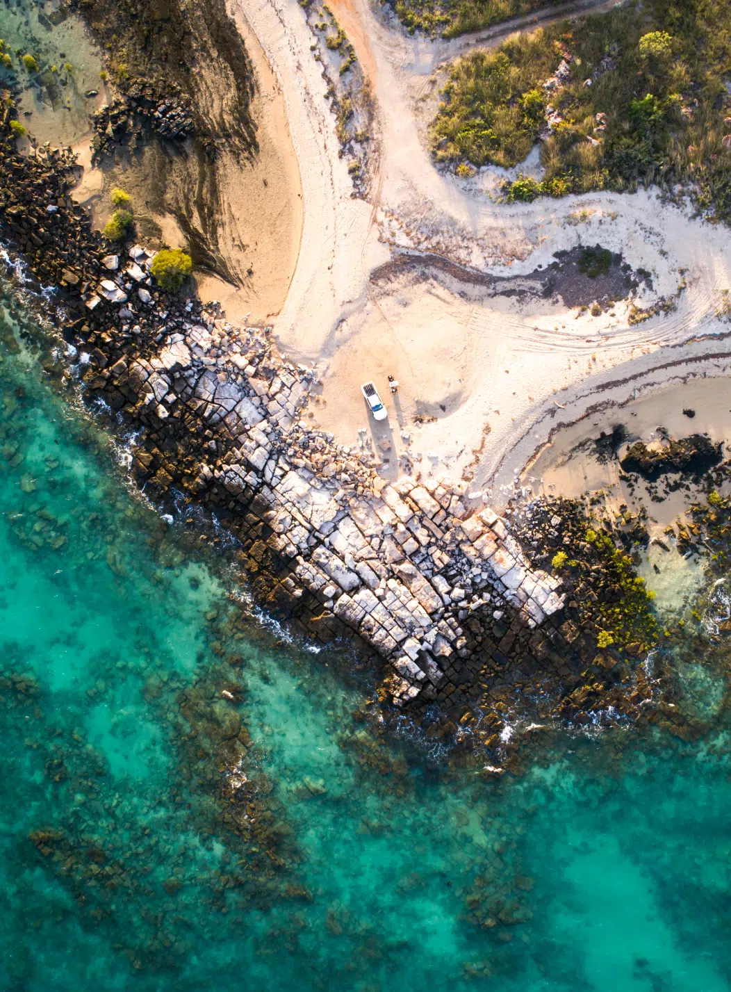 Aerial photo of Diver's Creek, the point of Cygnet Bay where the white sandy beach meets the surrounding clear water.