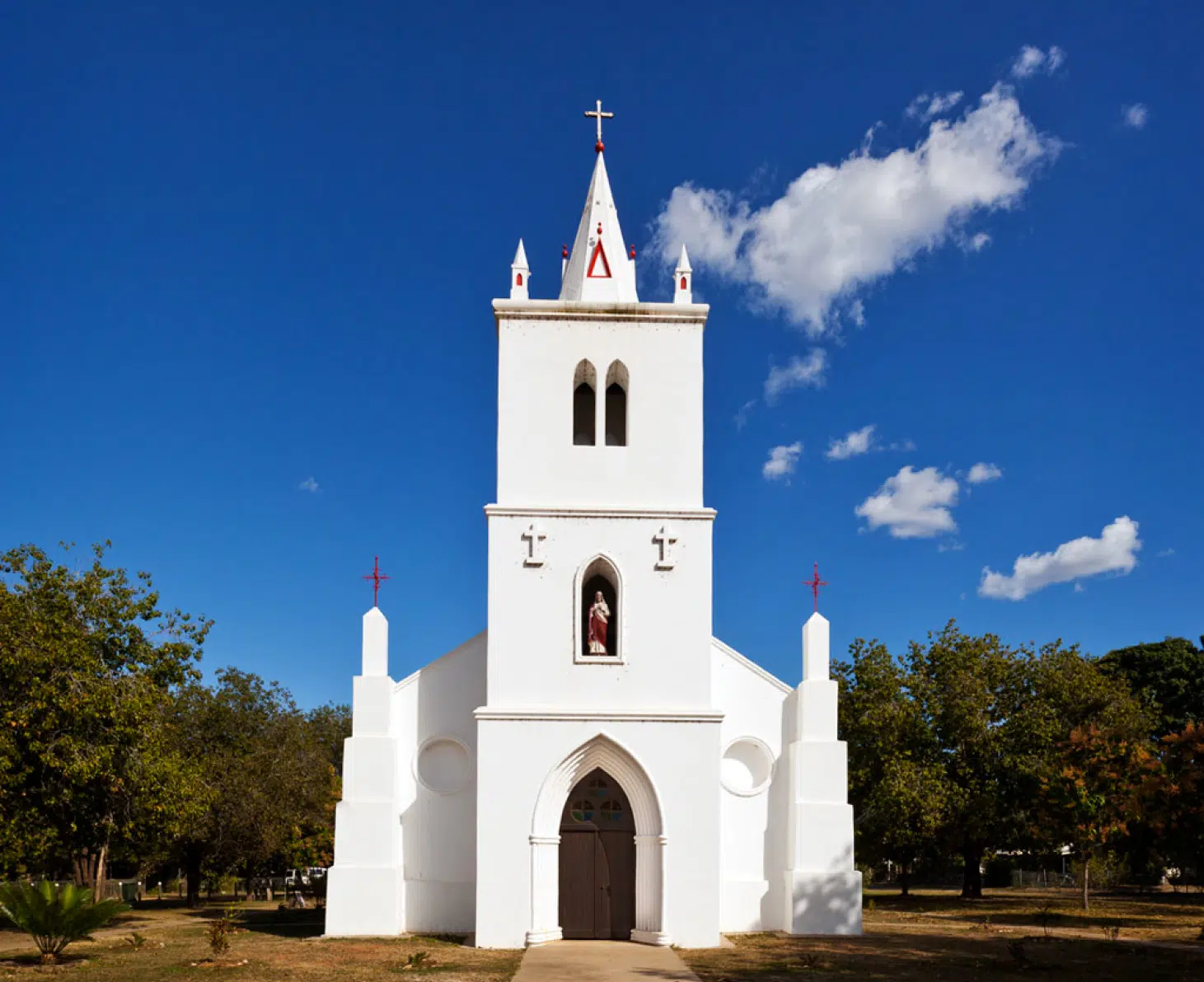 Beagle Bay, a church with a stark white exterior, and stunning cathedral arched windows is an incredible stopping point for the Cygnet Bay Pearl Farm's Planned Package - where visitors can enter to witness the beauty of this church. Renowned for it's unique Mother of Pearl interior, this church in Beagle Bay is a visit not to be missed by travelers.